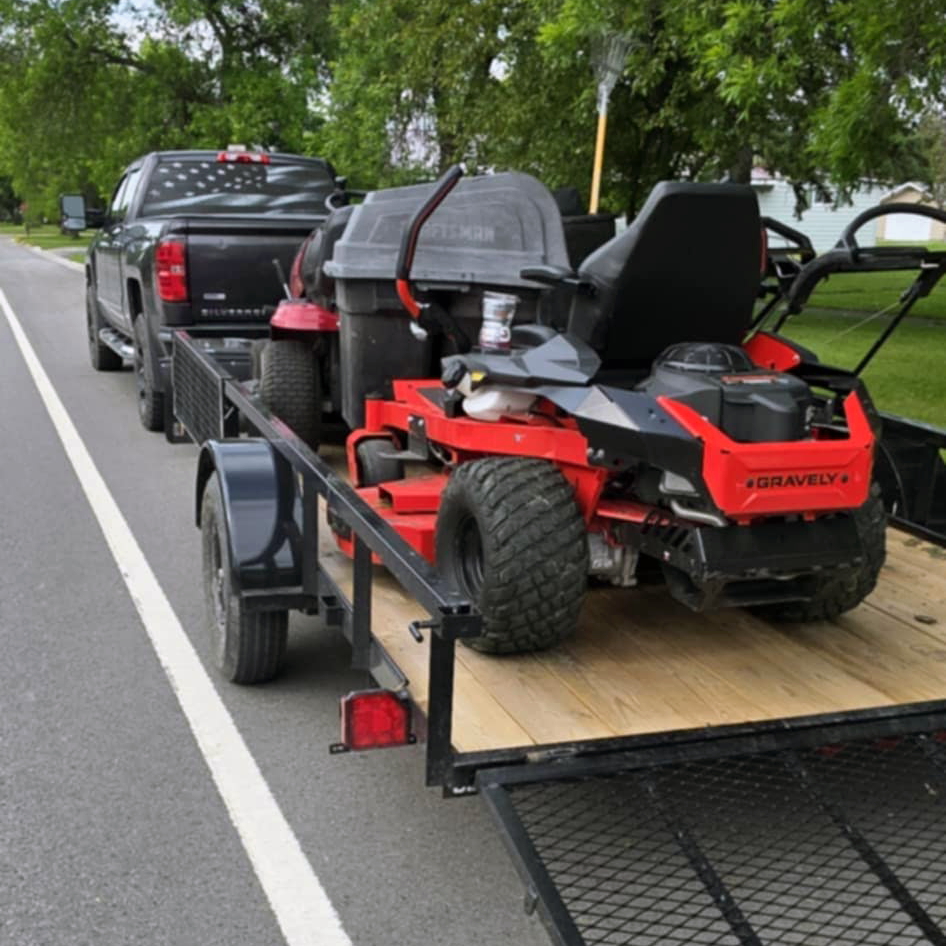 Professional equipment trailer with multiple mowers